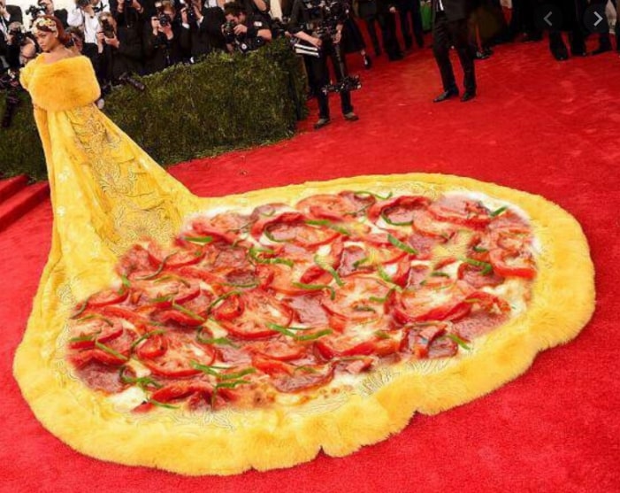 A pizza sitting on top of a rug 