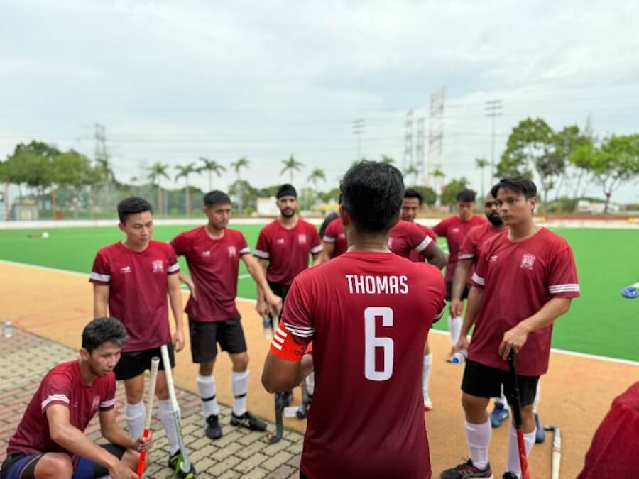 A group of men in sports uniforms