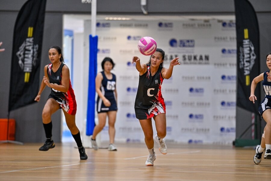 A group of women playing volleyball 